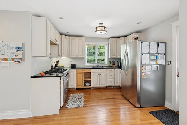 17 Tulip Rd, Rocky Point, NY 11778 - kitchen featuring appliances with stainless steel finishes, dark countertops, light wood-style floors, baseboards, and recessed lighting
