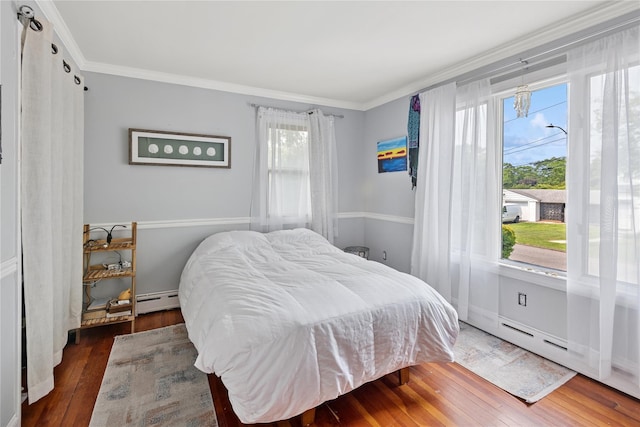 17 Tulip Rd, Rocky Point, NY 11778 - bedroom featuring ornamental molding, a baseboard heating unit, wood-type flooring, and baseboards