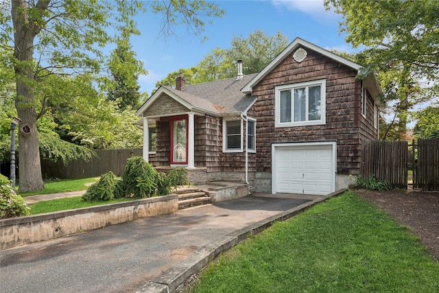 17 Tulip Rd, Rocky Point, NY 11778 - view of front of home featuring asphalt driveway, a chimney, roof with shingles, and a garage