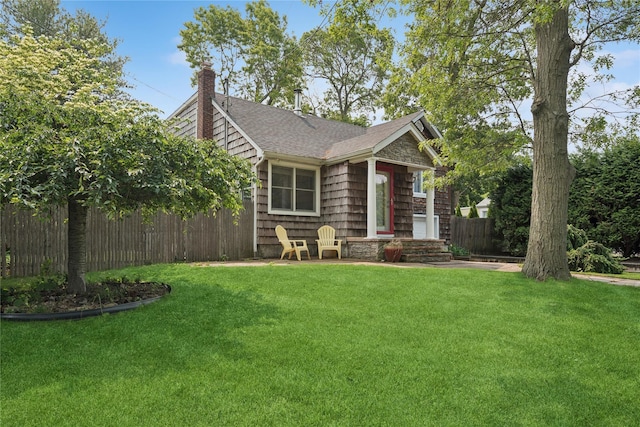 17 Tulip Rd, Rocky Point, NY 11778 - view of front of property featuring a chimney and roof with shingles