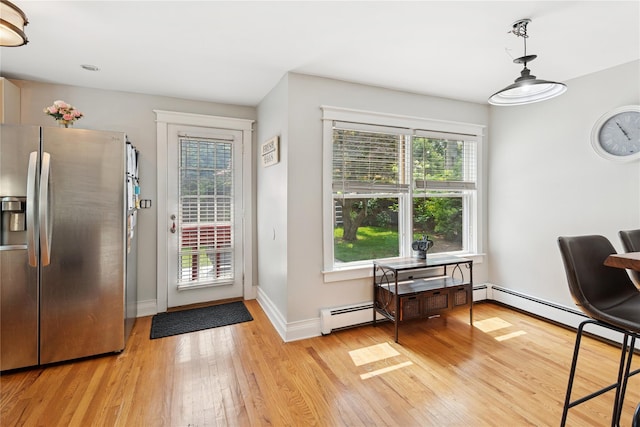 17 Tulip Rd, Rocky Point, NY 11778 - doorway to outside featuring light wood-style floors, plenty of natural light, and baseboards