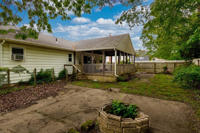56 Magro Dr, North Babylon, NY 11703 - rear view of property featuring roof with shingles