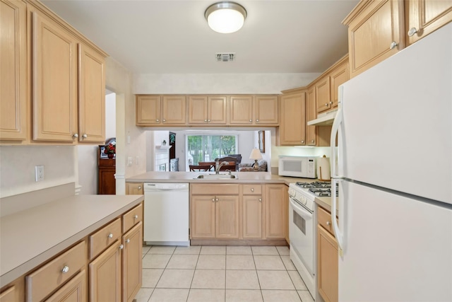 30 Joyces Way, Bay Shore, NY 11706 - kitchen featuring white appliances, light brown cabinetry, under cabinet range hood, a sink, and light countertops