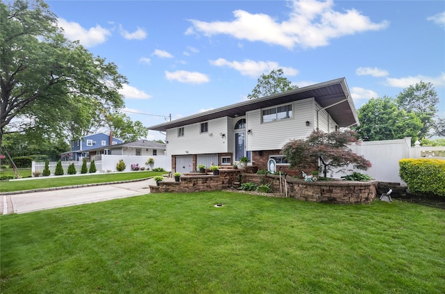 24 Sugarwood Ln, Commack, NY 11725 - split foyer home with a garage and driveway