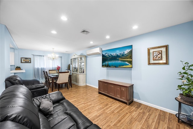 24 Sugarwood Ln, Commack, NY 11725 - living room featuring a wall mounted air conditioner, a chandelier, light wood finished floors, baseboards, and recessed lighting