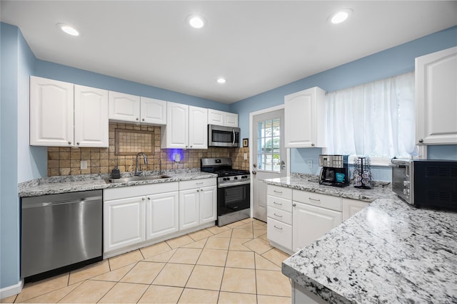 24 Sugarwood Ln, Commack, NY 11725 - kitchen with stainless steel appliances, a sink, tasteful backsplash, white cabinets, and recessed lighting