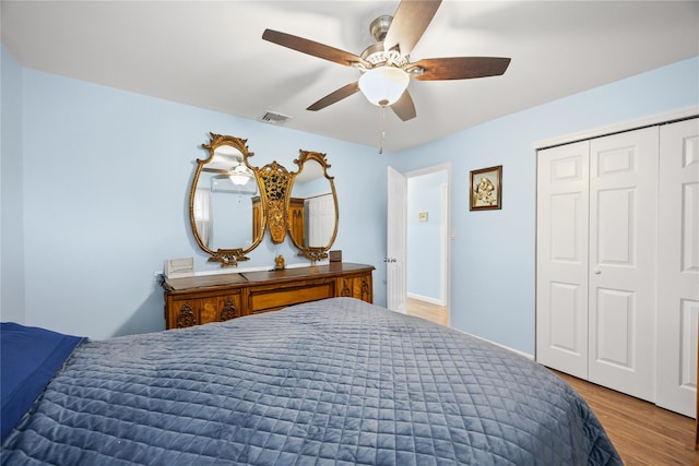 24 Sugarwood Ln, Commack, NY 11725 - bedroom featuring wood finished floors, a closet, and ceiling fan
