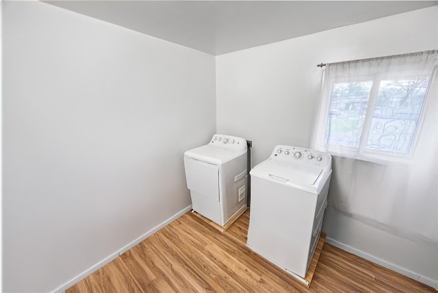 24 Sugarwood Ln, Commack, NY 11725 - washroom with washer and clothes dryer, light wood-style floors, and baseboards