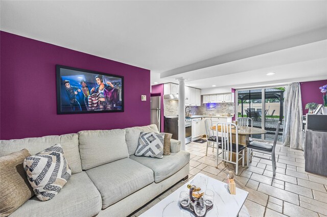 24 Sugarwood Ln, Commack, NY 11725 - living area with ornate columns and recessed lighting