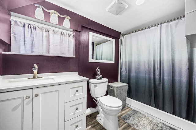 24 Sugarwood Ln, Commack, NY 11725 - bathroom with vanity, toilet, wood finished floors, and a shower with shower curtain