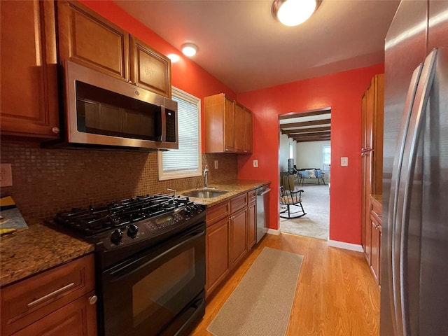 42 Saint Marks Ave, Freeport, NY 11520 - kitchen with appliances with stainless steel finishes, a sink, light wood-type flooring, and healthy amount of natural light