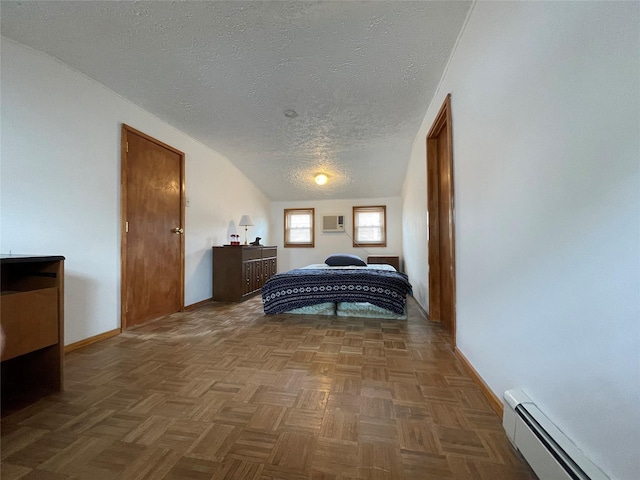 42 Saint Marks Ave, Freeport, NY 11520 - bedroom featuring baseboard heating, baseboards, a textured ceiling, and a wall mounted air conditioner