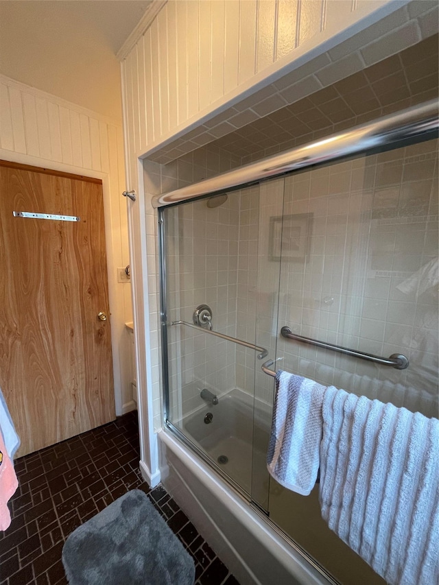 42 Saint Marks Ave, Freeport, NY 11520 - bathroom featuring enclosed tub / shower combo and brick patterned floors