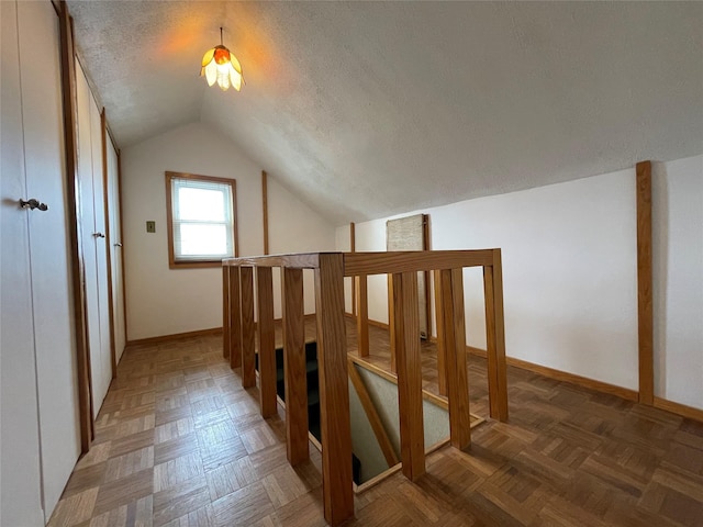 42 Saint Marks Ave, Freeport, NY 11520 - additional living space featuring lofted ceiling, a textured ceiling, and baseboards