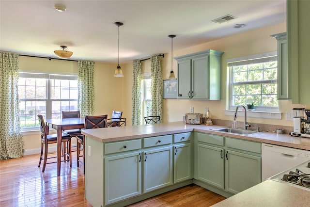 17 Gettysburg Dr Unit 17, Port Jefferson Station, NY 11776 - kitchen with a peninsula, a sink, and green cabinetry