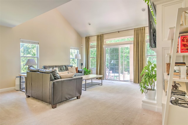 17 Gettysburg Dr Unit 17, Port Jefferson Station, NY 11776 - living area featuring light colored carpet, high vaulted ceiling, and baseboards