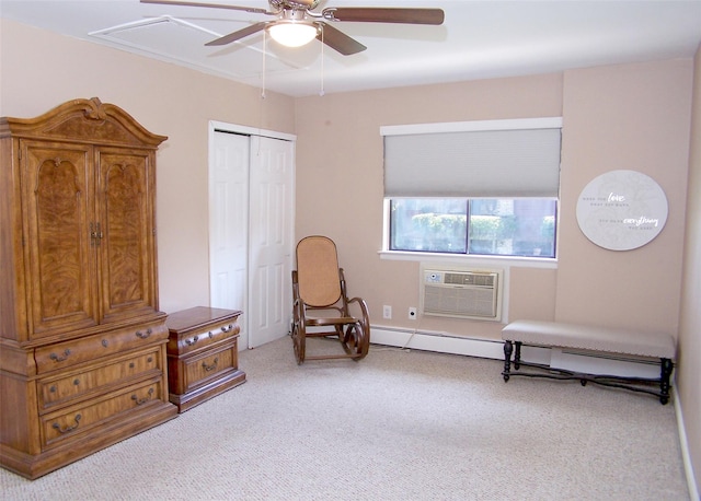 263 River Ave Unit 52, Patchogue, NY 11772 - sitting room with a wall unit AC, a ceiling fan, carpet, and attic access