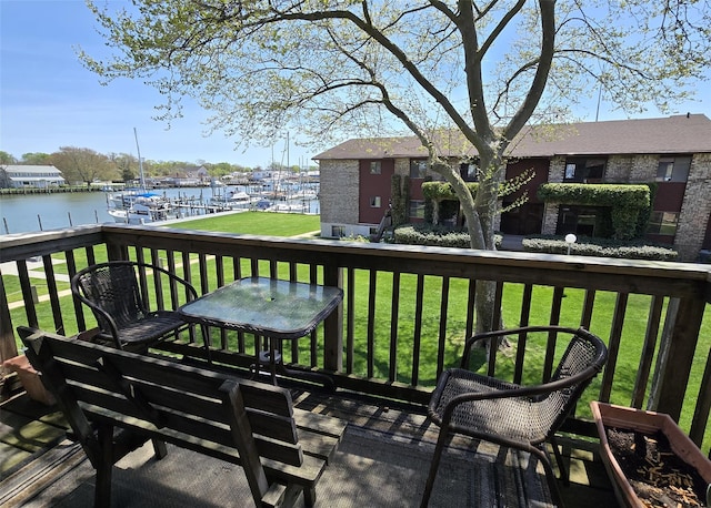 263 River Ave Unit 52, Patchogue, NY 11772 - wooden terrace featuring a water view and a lawn
