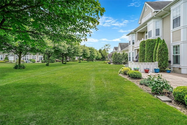 23 Sonata Ct, Lake Grove, NY 11755 - view of grassy yard featuring a patio area and a residential view