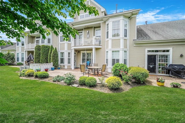 23 Sonata Ct, Lake Grove, NY 11755 - back of property with a patio area, a yard, and roof with shingles