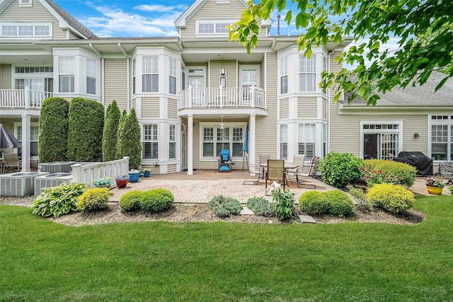 23 Sonata Ct, Lake Grove, NY 11755 - rear view of house featuring a yard and a patio area