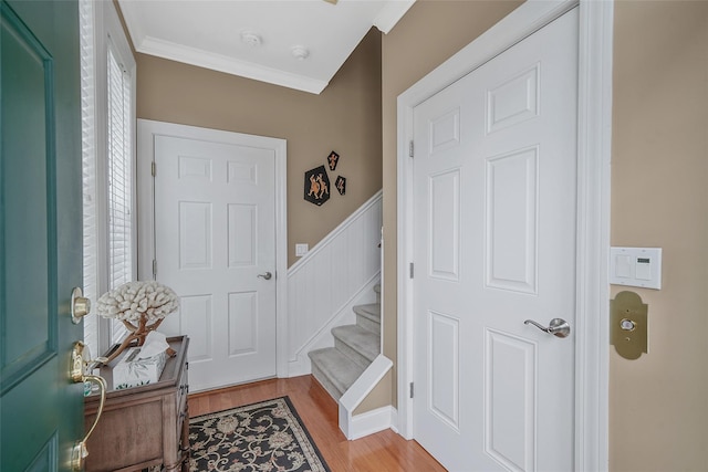 23 Sonata Ct, Lake Grove, NY 11755 - foyer entrance with stairway, light wood finished floors, and ornamental molding