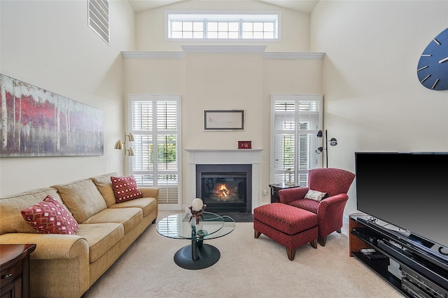 23 Sonata Ct, Lake Grove, NY 11755 - carpeted living area featuring a fireplace with flush hearth and high vaulted ceiling
