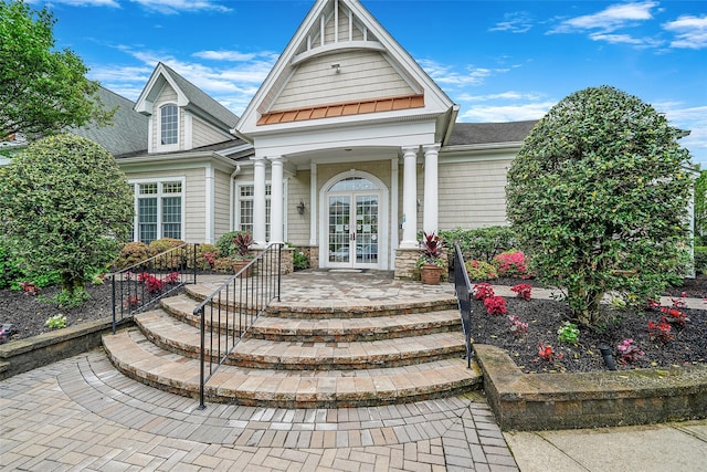 23 Sonata Ct, Lake Grove, NY 11755 - doorway to property with french doors and a shingled roof