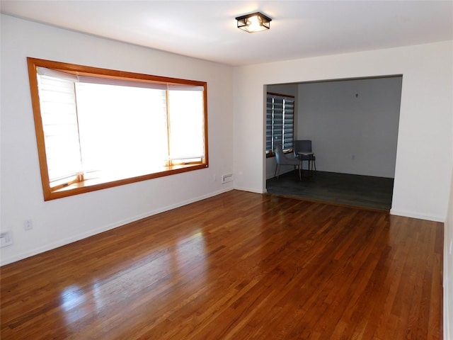 7 Audrey Ln, Commack, NY 11725 - spare room featuring wood finished floors and baseboards
