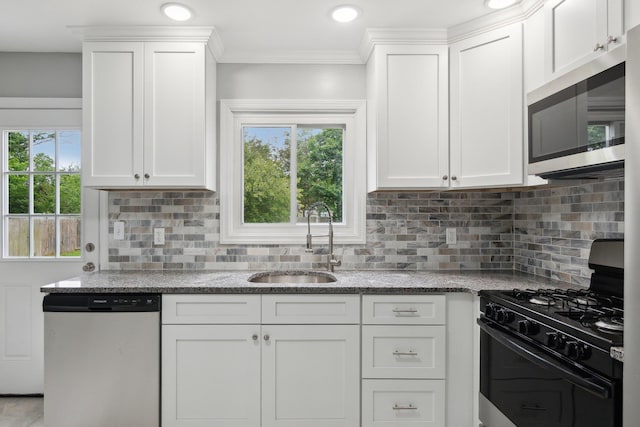 17 21 St Ave, Bay Shore, NY 11706 - kitchen featuring appliances with stainless steel finishes, a sink, white cabinetry, and ornamental molding