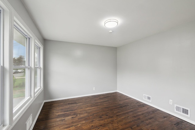 17 21 St Ave, Bay Shore, NY 11706 - empty room with dark wood-style flooring and baseboards