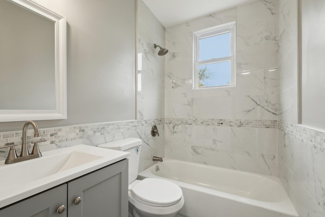 17 21 St Ave, Bay Shore, NY 11706 - bathroom with tile walls, toilet, vanity, shower / bathtub combination, and a wainscoted wall