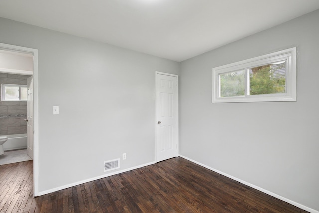 17 21 St Ave, Bay Shore, NY 11706 - spare room with dark wood-type flooring, healthy amount of natural light, and baseboards