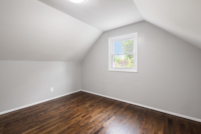 17 21 St Ave, Bay Shore, NY 11706 - additional living space with dark wood-style flooring, baseboards, and lofted ceiling