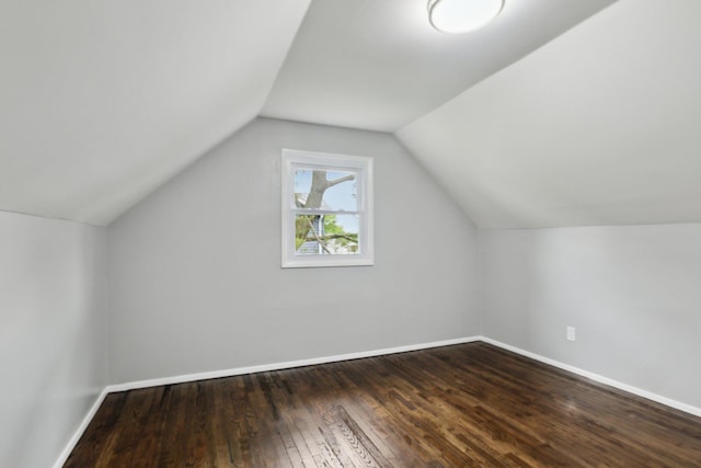 17 21 St Ave, Bay Shore, NY 11706 - additional living space featuring dark wood-style flooring, baseboards, and vaulted ceiling