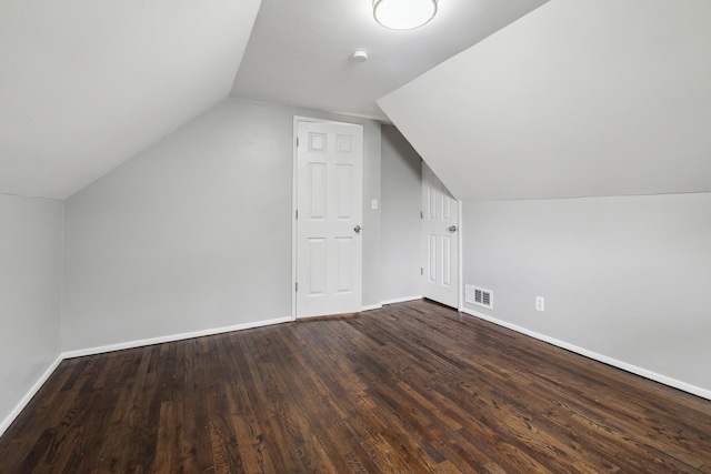 17 21 St Ave, Bay Shore, NY 11706 - bonus room with dark wood finished floors, lofted ceiling, and baseboards