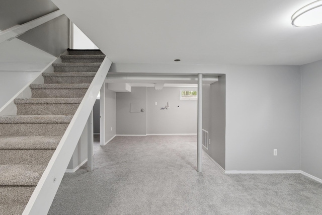 17 21 St Ave, Bay Shore, NY 11706 - below grade area with carpet floors, stairway, and baseboards