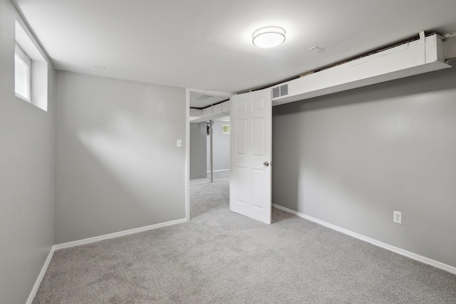17 21 St Ave, Bay Shore, NY 11706 - unfurnished bedroom featuring light carpet and baseboards