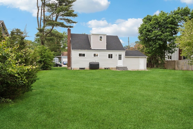 17 21 St Ave, Bay Shore, NY 11706 - rear view of house featuring entry steps, a chimney, oil tank, and a shingled roof
