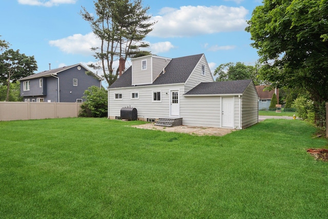 17 21 St Ave, Bay Shore, NY 11706 - back of house featuring heating fuel, a chimney, and a shingled roof