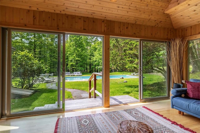 16 Juniper Ln, Woodstock, NY 12498 - sunroom / solarium featuring lofted ceiling and view of wooded area