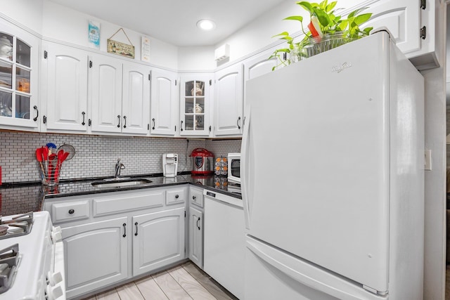 64-30 73rd Pl, Middle Village, NY 11379 - kitchen featuring white appliances, a sink, white cabinetry, glass insert cabinets, and recessed lighting