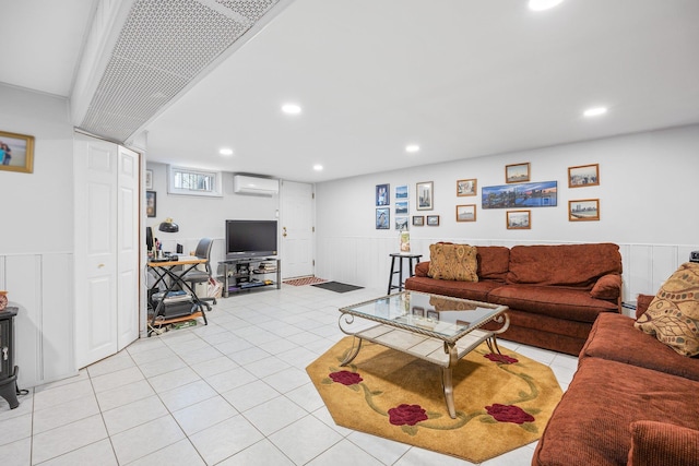 64-30 73rd Pl, Middle Village, NY 11379 - living room with a wall unit AC, a wainscoted wall, light tile patterned floors, recessed lighting, and baseboard heating