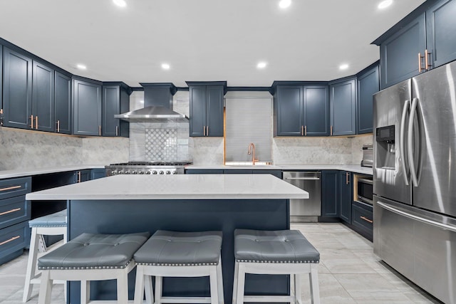 14-50 141st St, Whitestone, NY 11357 - kitchen with appliances with stainless steel finishes, wall chimney range hood, a kitchen breakfast bar, a sink, and recessed lighting