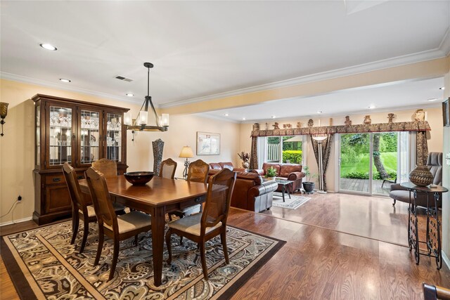 38 The Mews, Syosset, NY 11791 - dining area with wood finished floors, crown molding, and recessed lighting
