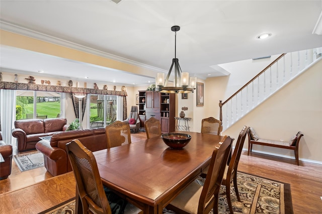 38 The Mews, Syosset, NY 11791 - dining room featuring a chandelier, wood finished floors, stairway, crown molding, and recessed lighting
