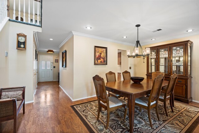 38 The Mews, Syosset, NY 11791 - dining room with a chandelier, ornamental molding, wood finished floors, baseboards, and recessed lighting