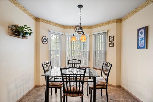 38 The Mews, Syosset, NY 11791 - dining area with baseboards and a chandelier