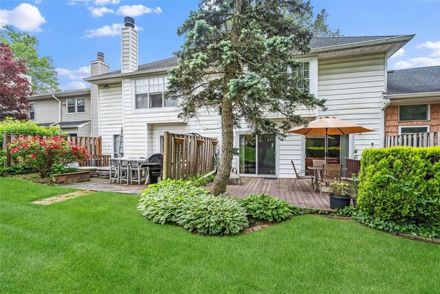 38 The Mews, Syosset, NY 11791 - rear view of property with a wooden deck, a chimney, and a shingled roof