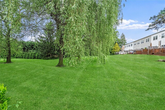 38 The Mews, Syosset, NY 11791 - view of green lawn featuring a wooden deck